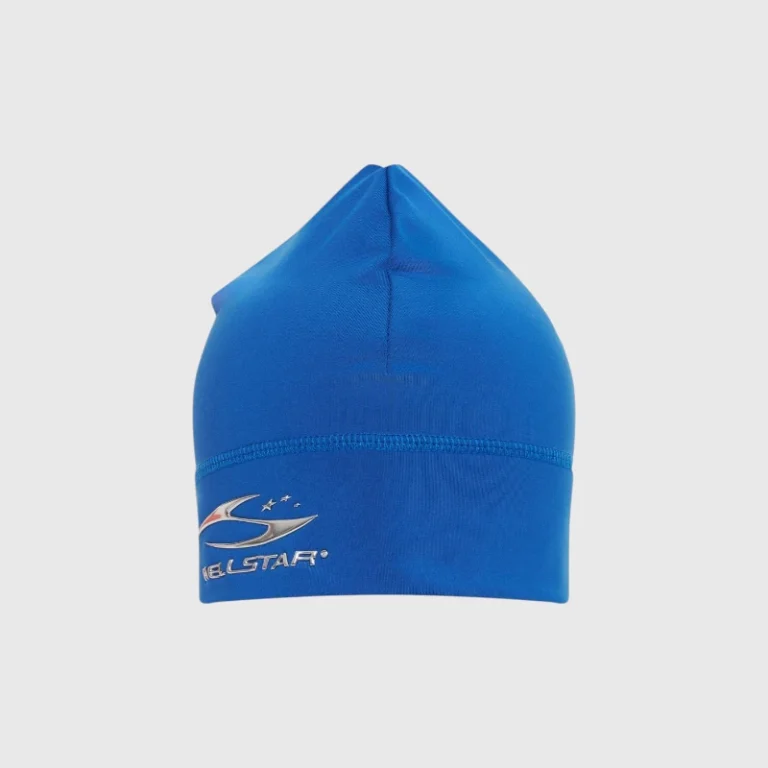 Bright blue Hellstar skull cap beanie featuring a prominent silver branded logo design on the front of the hat