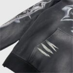 Close-up view of the Hellstar Airbrushed Skull Hoodie featuring detailed airbrushed graphic art and kangaroo pocket.
