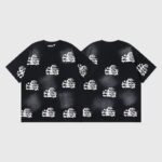 Black Hellstar short sleeve T-shirt featuring an all-over screen-printed pattern of white flaming skulls and crossbones.