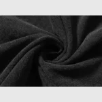 Close up view of the 100% cotton fabric texture on the black Hellstar Amethyst T-Shirt with a premium washed effect.