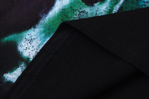 Detailed close-up view of the black fabric and printed graphic on the Hellstar Attacks Hypnotic Vision black t-shirt