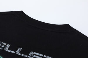 Close-up view of the ribbed collar detail on the black Hellstar Attacks Hypnotic Vision vintage washed graphic tee.