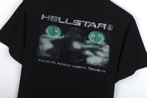 Hellstar Attacks Hypnotic Vision T-shirt in black featuring a unique graphic print with green hypnotic swirl eyes.