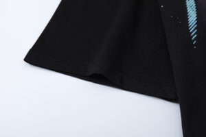 Close-up view of the sleeve detail on the Hellstar Attacks Hypnotic Vision black graphic t-shirt for men and women.