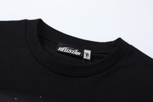 Close up view of the neck collar and branded interior size tag on the black Hellstar Attacks Hypnotic Vision t-shirt