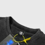 Close-up of the Hellstar Barbed Wire Rib Cage T-shirt collar showing the brand tag and attached product hang tag.