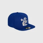 A blue Hellstar baseball fitted hat featuring a white embroidered star and flaming logo on the front panel.