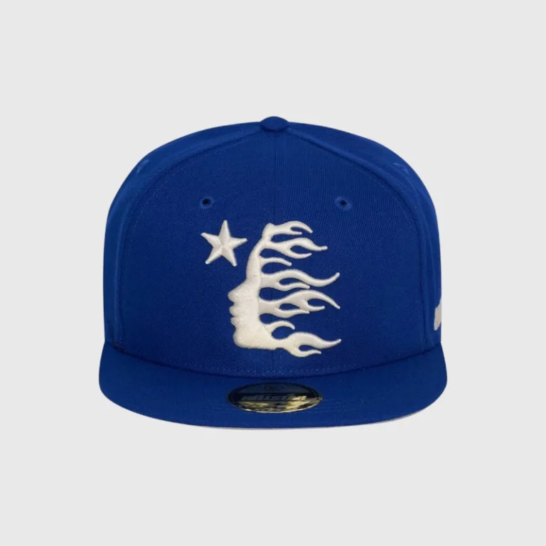 Hellstar blue baseball fitted hat featuring a white embroidered graphic of a star and a stylized flame face design.