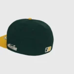Dark green Hellstar baseball fitted hat featuring premium embroidered branding and a structured crown design.