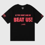 Hellstar Beat Us! T-Shirt in black cotton with red graphic slogan print for a bold streetwear look and premium comfort.