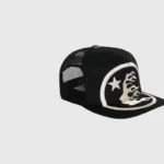 The black Hellstar Big Logo Trucker Snapback Hat featuring a white embroidered star and flame graphic design.
