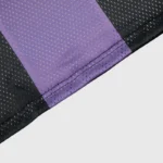 Close-up view of the Hellstar black and purple mesh patchwork fabric detail on a premium streetwear long sleeve tee.