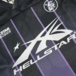 Close-up graphic detail of the Hellstar black and purple mesh patchwork long sleeve tee with logo branding