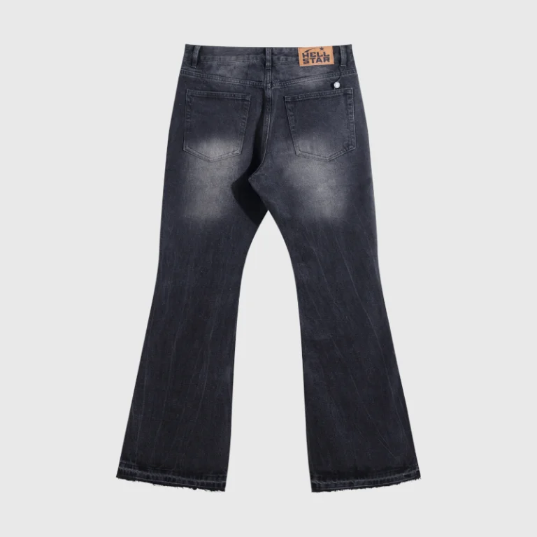Back view of premium Hellstar black denim flare jeans featuring a branded leather patch and iconic retro-inspired cut.