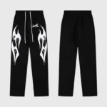 Black Hellstar tracksuit pants featuring white flame graphics with a drawstring waist and comfortable cotton fabric.