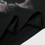 Close-up view of the premium black fabric texture and screen print detailing on the Hellstar Graphic Tee in Black.