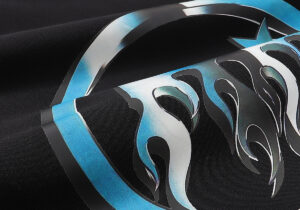 Close-up view of the screen-printed flame logo design on the premium black fabric of a Hellstar branded hoodie.