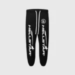 Black Hellstar sweatpants featuring a white graphic print logo, drawstring waist, and premium fleece fabric design.