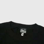 Close-up view of a Hellstar black t-shirt collar featuring the brand logo and size tag on the inner neck label.