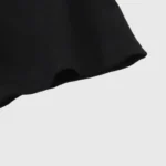 Close-up view of the sleeve detail on a black Hellstar classic cotton t-shirt featuring reinforced stitching.