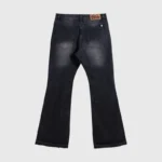 Back view of Hellstar Black Washed Denim Jeans featuring a signature logo patch and vintage faded black denim finish.