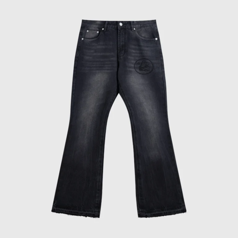 Front view of Hellstar Black Washed Denim Jeans with a vintage faded finish and a graphic logo print on the leg.