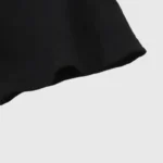 Close-up view of the premium soft cotton fabric texture on a black Hellstar Box Logo T-Shirt for a streetwear look.