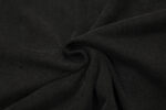 Close-up view of the premium 100% cotton fabric detail for the Hellstar Brainwashed black vintage washed T-shirt.