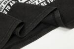 Close-up of the vintage washed fabric and screen print design on the Hellstar Brainwashed Black unisex T-shirt.