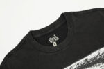 Close-up view of the branded neck label on a vintage washed black Hellstar Brainwashed 100% cotton unisex T-shirt.