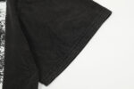 Close-up view of the sleeve detail on a black Hellstar Brainwashed T-shirt featuring a vintage washed graphic print.