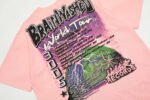 Pink Hellstar Brainwashed World Tour graphic t-shirt featuring a custom-milled vintage-washed cotton streetwear design.