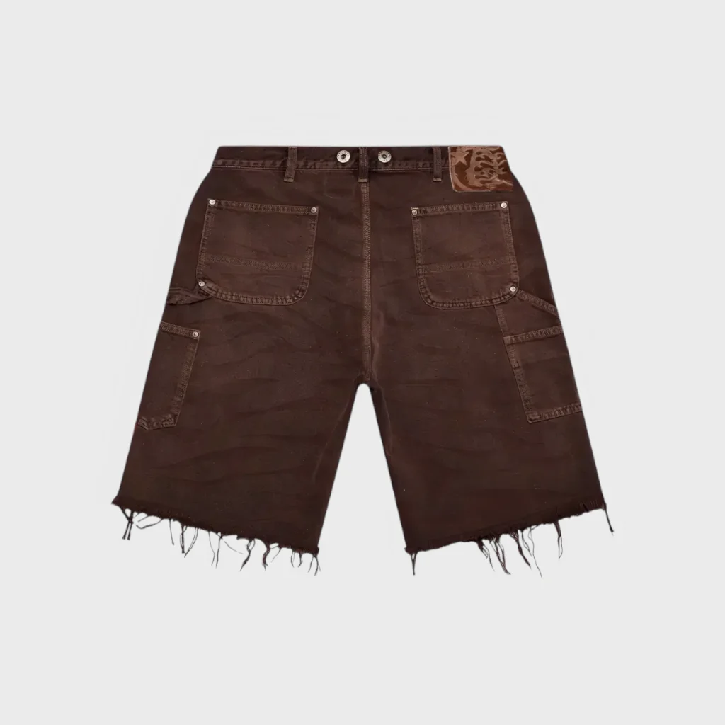 Premium Hellstar brown denim shorts featuring a relaxed streetwear fit, heavy cotton construction, and raw frayed hems.