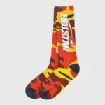 Pair of Hellstar logo socks featuring a camouflage pattern in a vibrant multi-color design for streetwear enthusiasts.