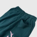 Dark green Hellstar Capsule 8 Paradise sweatpants waist and pocket detail featuring premium fleece fabric quality.