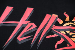 Close-up view of the bold Hellstar branding and graphic screen print design featured on the Capsule 8 black T-shirt.