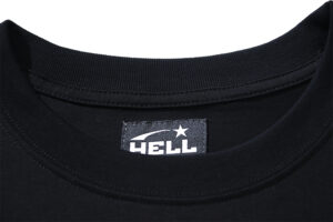 Close up view of the inner neck label on a black Hellstar Capsule 8 T-Shirt featuring the brand logo graphic.