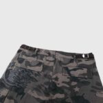 Hellstar Cargo Shorts in camo print featuring back flap pockets and tactical adjustable waist strap detailing.