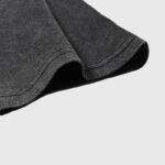 Close-up view of the premium vintage-washed black cotton fabric texture used for the Hellstar Cherubs T-Shirt.