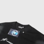 Close-up of the Hellstar Chrome Logo black t-shirt showing the internal brand neck label and authenticity hang tag.