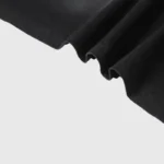 Close-up view of the premium soft-touch cotton fabric texture on the black Hellstar Chrome Logo graphic t-shirt.