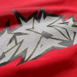 Close up view of the Hellstar Crack Print T-Shirt featuring a distressed graffiti graphic on premium soft red cotton.