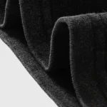 Close-up view of the premium black cotton fabric used for the Hellstar Crochet Jesus T-shirt, showing texture.