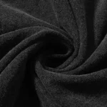 Close-up view of the premium black cotton fabric used for the Hellstar Crochet Jesus T-shirt streetwear design.
