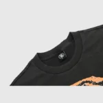 Close up of the crew neck collar and brand label detail on the Hellstar Dennis Rodman graphic t-shirt in black.