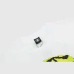 Detailed view of the collar and brand tag on a white Hellstar Dennis Rodman graphic t-shirt for men.