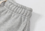 Close-up of the grey adjustable elastic waistband with drawstring on Hellstar Enlightenment fleece sweatpants.