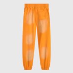 Back view of Hellstar Fire Orange elastic bottom sweatpants featuring a unique vintage washed faded design.