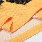 Close-up of the high-quality breathable orange mesh fabric used in the Hellstar Flame 66 long sleeve tee.