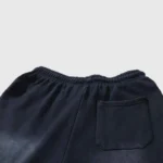 Back view of the black Hellstar Flame sweatpants featuring an elastic waistband and a single back pocket design.